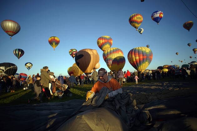October 9, 2019, Albuquerque, NEW MEXICO, USA: 100919 .Jeff Sakasitz,<cq>, , of Gallup, NM folds the tarp of the True :Lee New Mexico balloon during Wednesday s Flight of the Nations Mass Ascension. Photographed on Wednesday October 9, 2019 . Journal Albuquerque USA - ZUMAab1_ 20191009_zaf_ab1_006 Copyright: xAdolphexPierre-Louisx