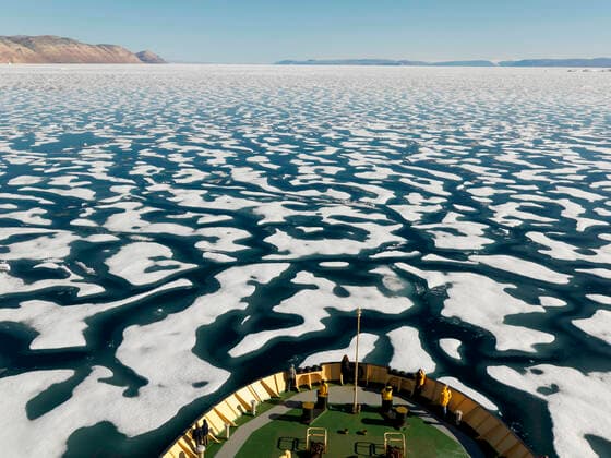 Broken one year ice off the coast of Ellesmere Island, seen from prow of boat, Nunavut, Canada, August 2007.  1533664 PalxHermansen