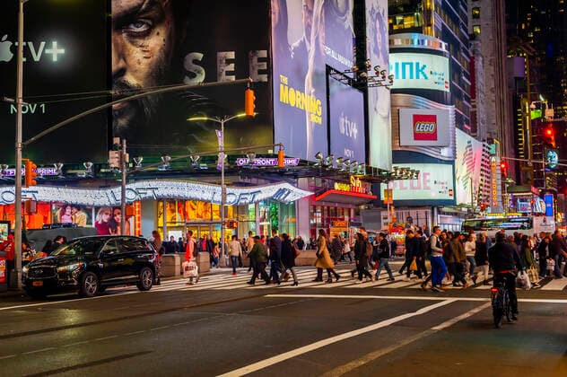 Apple TV+ streaming service advertising People cross 42nd street passing advertising for the Apple TV+ streaming service, featuring an ad for The Morning Show with Jennifer Anniston, among other programs, in Times Square in New York on Tuesday, October 15, 2019. The new service will debut November 1 at the bargain rate of $4.99 per month. (  RichardxB.xLevine