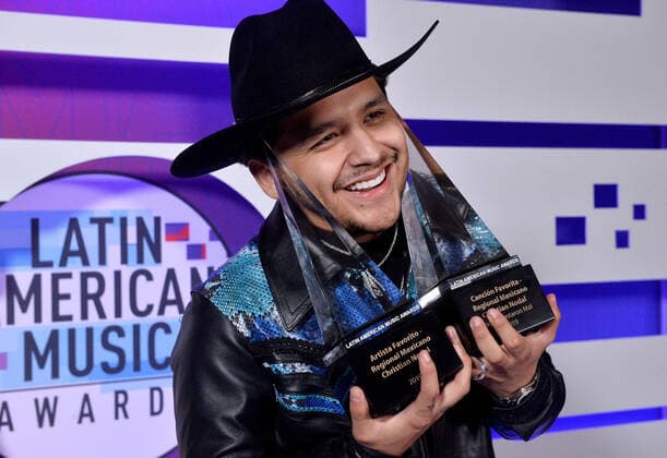 Christian Nodal appears backstage with his awards for Favorite Artist and Favorite Song-Regional Mexican for No Te Contaron Mai during the fifth annual Latin American Music Awards at the Dolby Theatre in the Hollywood section of Los Angeles on Thursday, October 17, 2019. The annual event honors outstanding achievements for artists in the Latin music industry.  LAP20191017390 JIMxRUYMEN