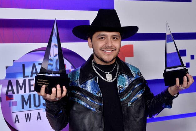 Christian Nodal appears backstage with his awards for Favorite Artist and Favorite Song-Regional Mexican for No Te Contaron Mai during the fifth annual Latin American Music Awards at the Dolby Theatre in the Hollywood section of Los Angeles on Thursday, October 17, 2019. The annual event honors outstanding achievements for artists in the Latin music industry.  LAP20191017391 JIMxRUYMEN
