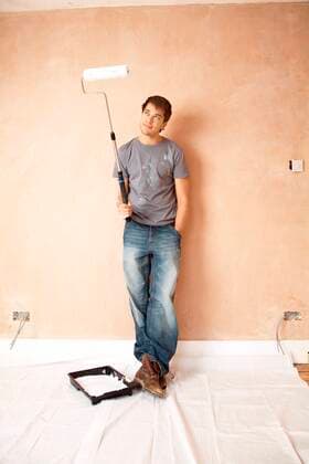 Man Holding Paint Roller,model released, Symbolfoto,property released 03B63418