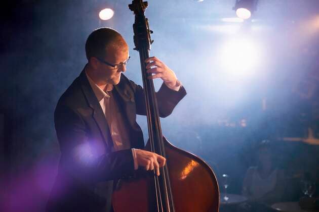 Man Playing Double Bass in Jazz Club,model released, Symbolfoto,property released 03B66325