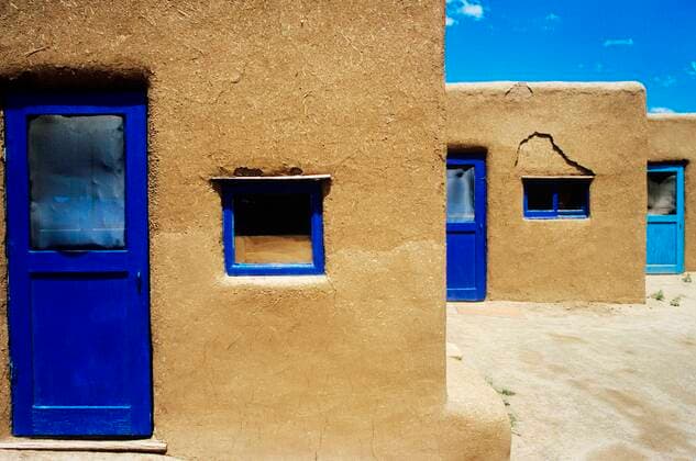 Adobe houses with blue windows and door frames 03B71830