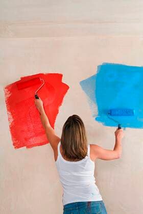 Woman Painting Wall with Different Colors,model released, Symbolfoto,property released 03B74044