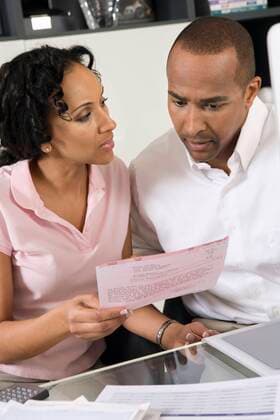 Couple Discussing a Bill,model released, Symbolfoto,property released 03B96695