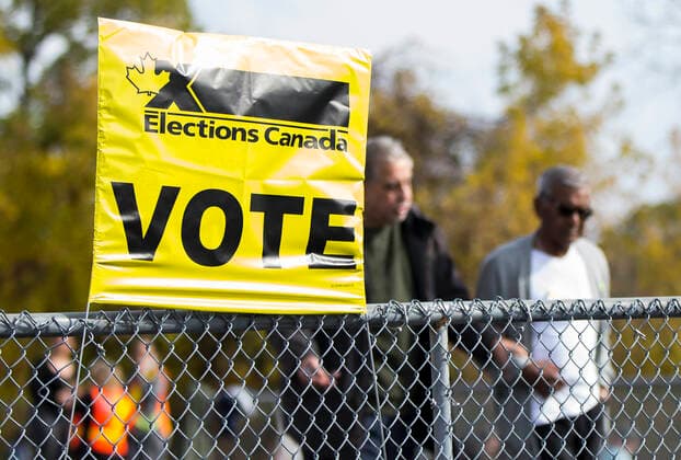 (191021) -- TORONTO, Oct. 21, 2019 -- People exit a polling station in Toronto, Canada, Oct. 21, 2019. Canadians on Monday began voting in a general election after a 40-day campaign season. (Photo by Xinhua) CANADA-TORONTO-NATIONAL ELECTION ZouxZheng 