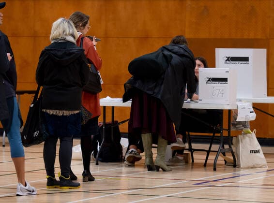 (191021) -- VANCOUVER, Oct. 21, 2019 (Xinhua) -- People prepare to cast their votes at a polling station in Vancouver, Canada, Oct. 21, 2019. Canadians on Monday began voting in a general election after a 40-day campaign season. (Photo by Andrew Soong Xinhua) CANADA-VANCOUVER-NATIONAL ELECTION 