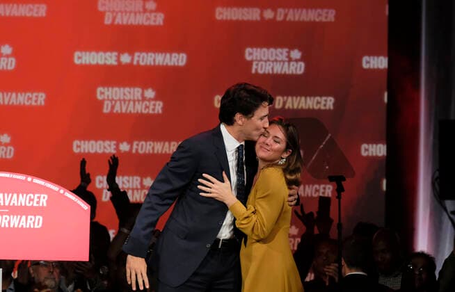 (191022) -- MONTREAL, Oct. 22, 2019 -- Canadian Prime Minister Justin Trudeau (L) kisses his wife Sophie Gregoire Trudeau at the Liberal Party campaign headquarters in Montreal, Canada, Oct. 21, 2019. Canadian Prime Minister Justin Trudeau s Liberal Party won the 2019 Canadian federal election Monday night, according to Elections Canada on Tuesday. (Photo by Raffi Kirdi Xinhua) CANADA-MONTREAL-FEDERAL ELECTION LixBaodong 