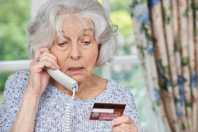 Senior Woman Giving Credit Card Details On The Phone,model released, Symbolfoto ING_39524_01863