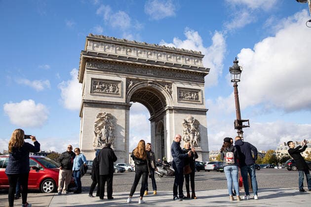 Tourists take photos in front of the Arc de Triomphe in Paris on October 21st, 2019.  Copyright: xChristophexMorinx
