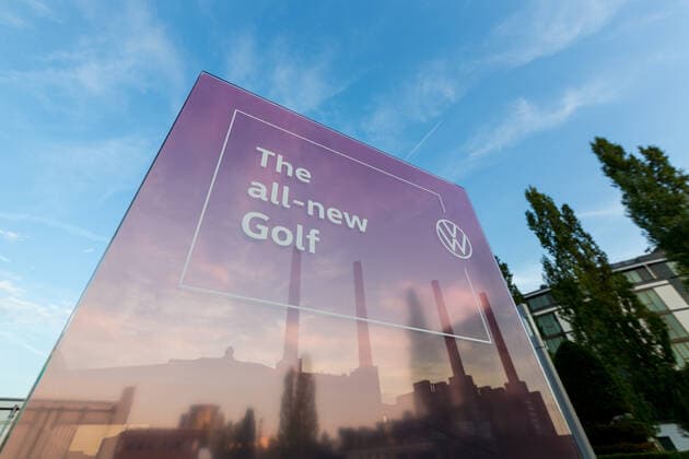 24 10 2019, xtgx, Wirtschaft Auto, Volkswagen World Premiere Presentation Golf 8 acht emspor, v l The sign the all new Golf reflects the four chimneys of the VW power plant, Wolfsburg landmark, symbolic image, symbol photo DFL DFB REGULATIONS PROHIBIT ANY USE OF PHOTOGRAPHS as IMAGE SEQUENCES and or QUASI VIDEO Wolfsburg