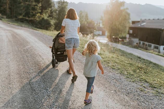 Mother with daughter, stroller and dog walking on forest path model released Symbolfoto  DWF00506