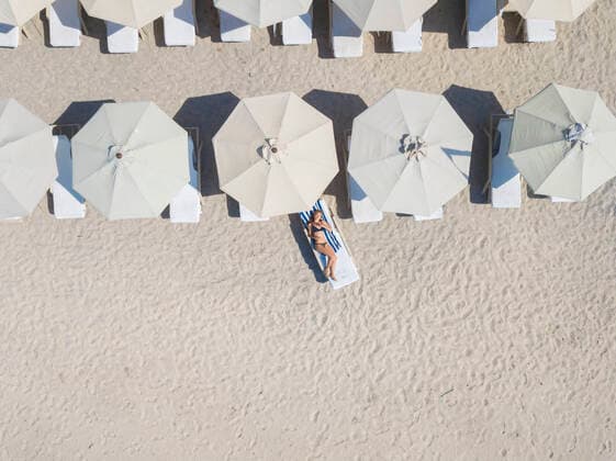 Woman lying on sun lounger at the beach, Gili Air, Gili Islands, Indonesia model released Symbolfoto  KNTF03588