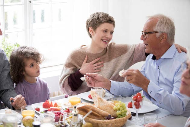 Happy extended family having lunch at home model released Symbolfoto property released  MJFKF00074