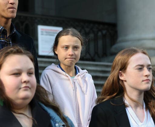 Swedish teen activist Greta Thunberg arrives for the post federal election Friday climate strike march starting and ending at the Vancouver Art Gallery in Vancouver, British Columbia on October 25, 2019. Organized by local youth-led, Sustainabiliteens, Greta and a turn out of nearly 10,000 climate activists demand action from industry and the various levels of government and are supporting the 15-youth who announced their plans to sue the federal government alleging it has contributed to climate change.  VAP2019102503 HEINZxRUCKEMANN