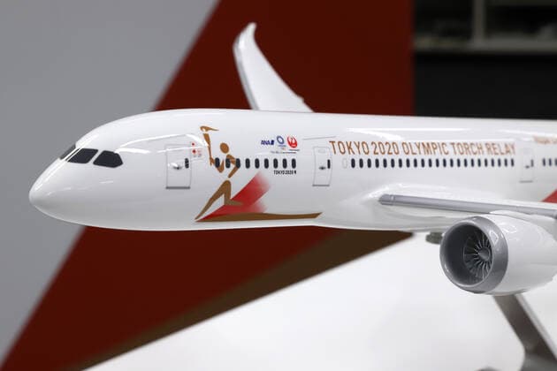 October 25, 2019, Tokyo, Japan - A model plane with a special design for the aircraft to deliver Olympic flame from Greece is displayed in Tokyo on Friday, October 25, 2019. Judo Olympic gold medalist Tadahiro Nomura and women s wrestling gold medalist Saori Yoshida will carry Olympic flame back to Japan next March for Tokyo 2020 Olympics torch relay.  (115129903)