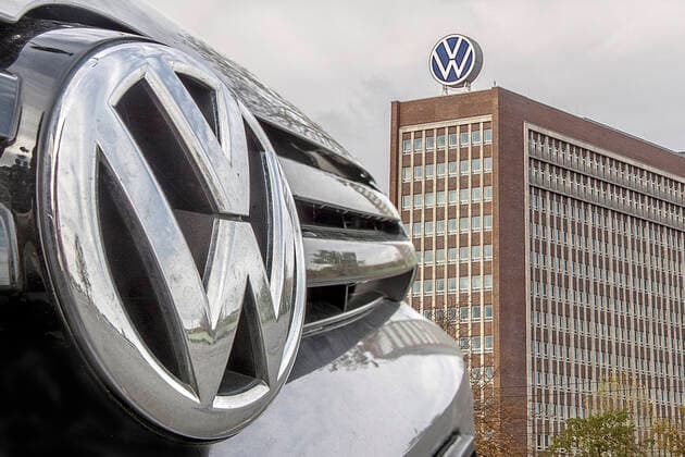 VW badge of a car from the VW production with the VW administration building with new VW emblem in Wolfsburg seen on 27 10 2019 on the parking lot at Heinrich Nordhoff Str
