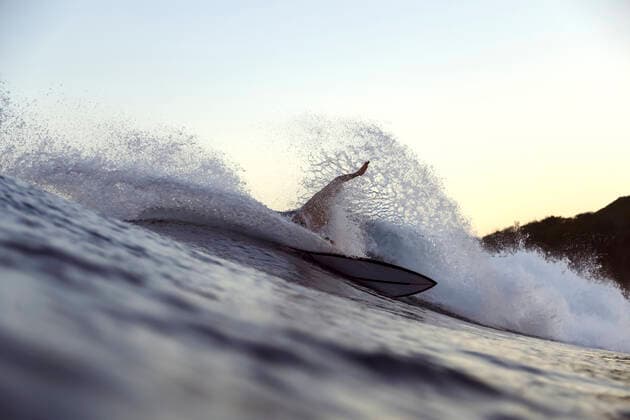 Surfer on a wave Indonesia, West Nusa Tenggara CR_KOTRIN191021A-222218-01