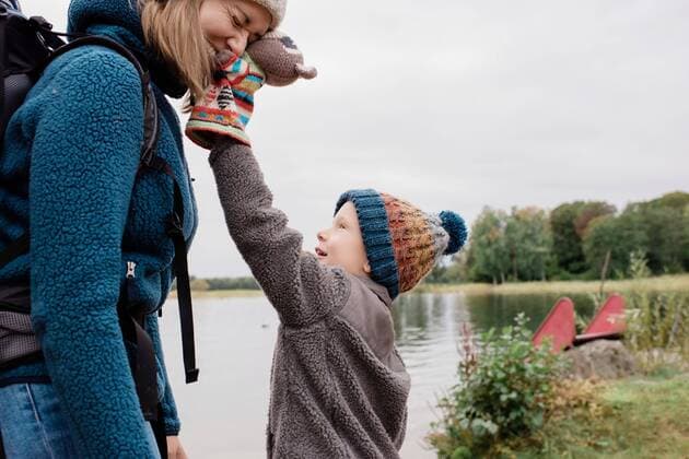 mother and son playing together laughing outside whilst camping Sweden, Stockholm County, Norrtälje CR_RABE191022-210190-01