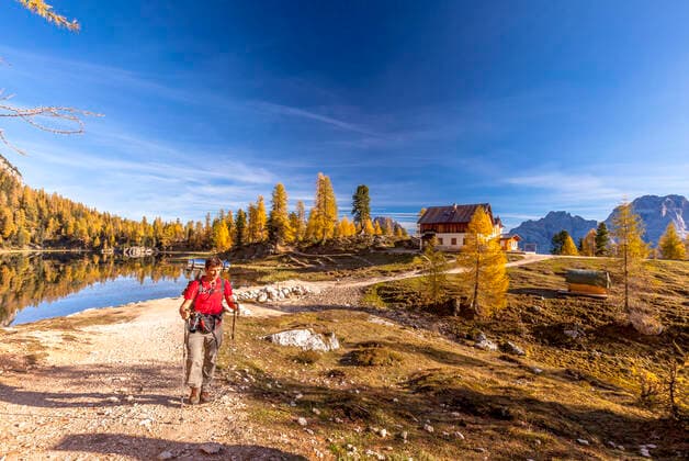 Hiker at Croda Del Lago in autumn, Dolomites, Cortina, Veneto, Italy Italy, Veneto, Cortina d Ampezzo CR_ROMO191011-220476-01