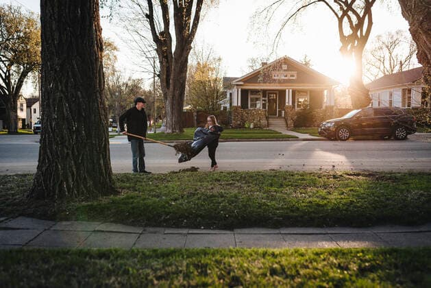 Kids Rake During Fall Yard Work United States, North Dakota, Bismarck R_LYLE191011A-152398-01