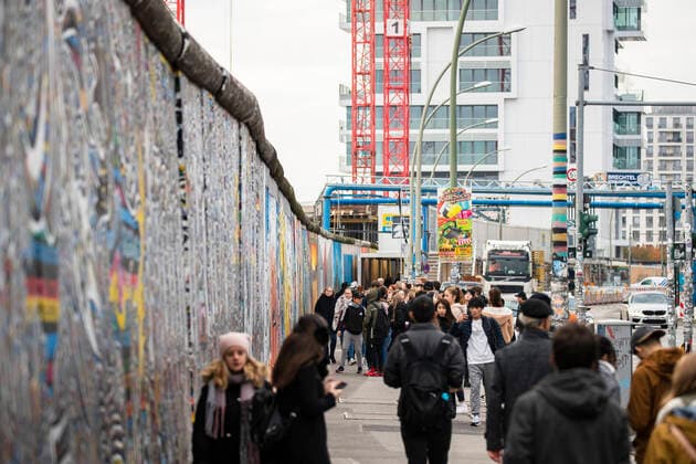 People walk at the East Side Gallery in Berlin on 7 November 2019 On 9 November Berlin celebrates 30 years since the fall of the Berlin Wall 30 years since the fall of the Berlin Wall