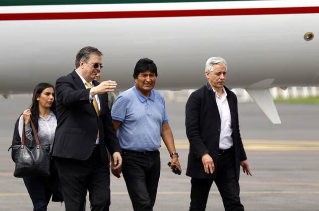 (191112) -- MEXICO CITY, Nov. 12, 2019 (Xinhua) -- Evo Morales (front, C) is welcomed by Mexican Foreign Minister Marcelo Ebrard (front, L) upon his arrival at the airport in Mexico City, capital of Mexico, on Nov. 12, 2019. Evo Morales, who had been offered political asylum by the Mexican government after announcing his resignation as Bolivian president, arrived in Mexico City on Tuesday. (Xinhua Francisco Canedo) MEXICO-MEXICO CITY-EVO MORALES-ARRIVAL 