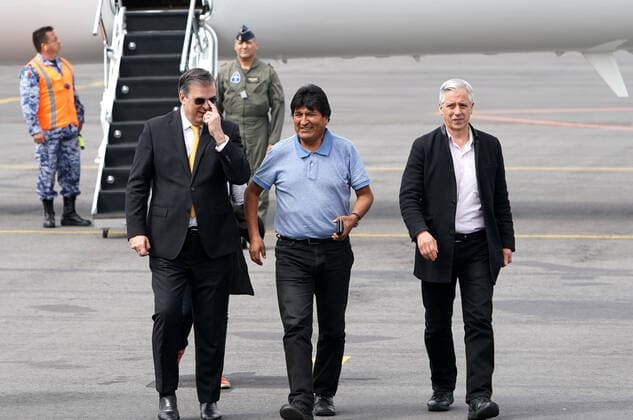 (191112) -- MEXICO CITY, Nov. 12, 2019 -- Evo Morales (front, C) is welcomed by Mexican Foreign Minister Marcelo Ebrard (front, L) upon his arrival at the airport in Mexico City, capital of Mexico, on Nov. 12, 2019. Evo Morales, who had been offered political asylum by the Mexican government after announcing his resignation as Bolivian president, arrived in Mexico City on Tuesday. ) MEXICO-MEXICO CITY-EVO MORALES-ARRIVAL DavidxdexlaxPaz 