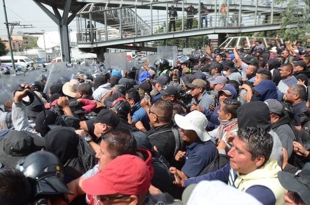 Riot troops face federal police officers that block the main entrance to terminal 1 of Mexico City International Airport, Mexico, 12 November 2019. A group of Mexican federal policemen dissatisfied with the creation of the National Guard maintain a blockade in the accesses of the International Airport of Mexico City (AICM), which has resulted in some clashes with capital police, just the day Evo Morales arrived. There are road problems to access the AICM Terminal 1 by demonstration. Please take precautions. Use alternate routes, airport authorities said on Twitter. Mexican federal police block access to the capital s airport !ACHTUNG: NUR REDAKTIONELLE NUTZUNG!  Copyright: xStrx MEX8566 20191113-637092086749369717