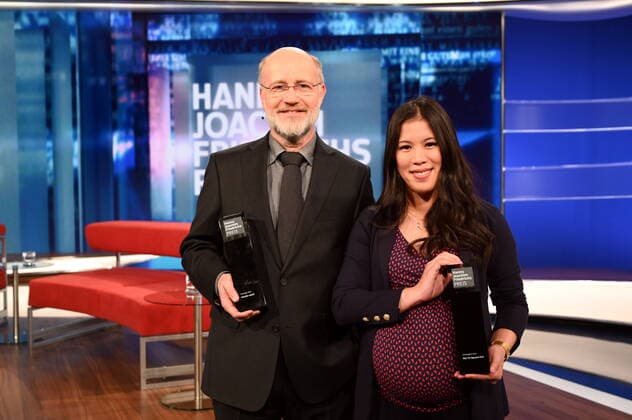 The journalists and award winners Harald Lesch, l r, Mai Thi Nguyen Kim pose at the award ceremony of the Hanns Joachim Friedrichs Preis für Fernsehjournalismus 2019 on 14 11 2019 in Cologne The prize is awarded once a year to television journalists who have achieved outstanding results in their work