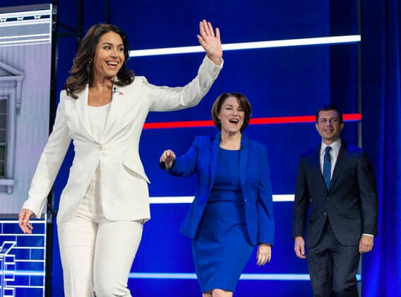 November 20, 2019, Atlanta, Georgia, USA: From left, TULSI GABBARD, AMY KLOBUCHAR, PETE BUTTIGIEG take the stage for the Democratic Presidential Debate held at the Tyler Perry Studios. Atlanta U.S. - ZUMAce6_ 20191120_zaf_ce6_010 Copyright: xBrianxCahnx