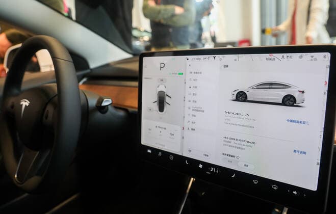 (191122) -- SHANGHAI, Nov. 22, 2019 -- Photo taken on Nov. 22, 2019 shows the interior of a made-in-China Tesla Model 3 at a Tesla experience center in east China s Shanghai. Tesla officially unveiled its Model 3 electric vehicle manufactured in a Shanghai gigafactory on Friday in Shanghai, and announced it will start delivering the made-in-China cars before late January. ) CHINA-SHANGHAI-TESLA-MODEL 3-MADE IN CHINA-UNVEILING (CN) DingxTing 