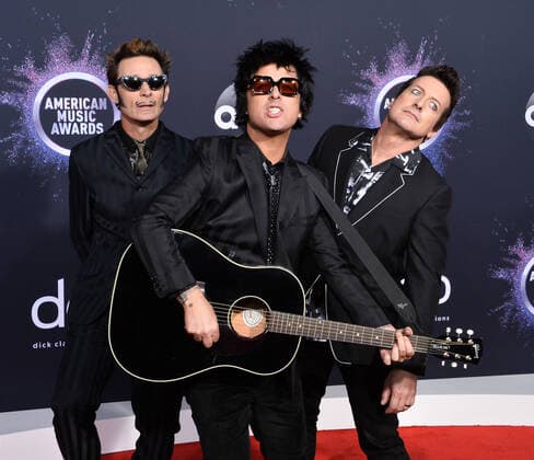 (L-R) Mike Dirnt, Billie Joe Armstrong and Tré Cool of Green Day arrive for the 47th annual American Music Awards at the Microsoft Theater in Los Angeles on Sunday, November 24, 2019.  LAP20191124096 JIMxRUYMEN