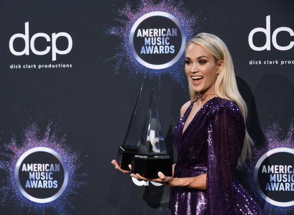 Singer Carrie Underwood appears backstage with her awards for Favorite Album - Country and the Favorite Female Artist - Country, during the 47th annual American Music Awards at the Microsoft Theater in Los Angeles on Sunday, November 24, 2019.  LAP20191124321 JIMxRUYMEN