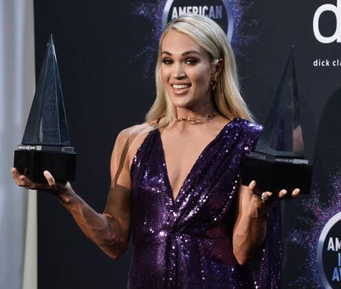 Singer Carrie Underwood appears backstage with her awards for Favorite Album - Country and the Favorite Female Artist - Country, during the 47th annual American Music Awards at the Microsoft Theater in Los Angeles on Sunday, November 24, 2019.  LAP20191124326 JIMxRUYMEN