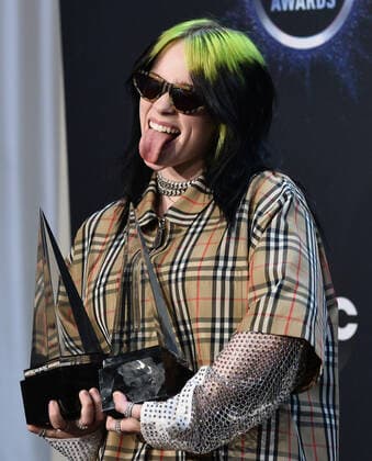 Singer Billie Eilish appears backstage with her awards for New Artist of the Year and Alternative Artist, during the 47th annual American Music Awards at the Microsoft Theater in Los Angeles on Sunday, November 24, 2019.  LAP20191124371 JIMxRUYMEN