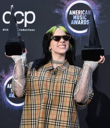 Singer Billie Eilish appears backstage with her awards for New Artist of the Year and Alternative Artist, during the 47th annual American Music Awards at the Microsoft Theater in Los Angeles on Sunday, November 24, 2019.  LAP20191124375 JIMxRUYMEN