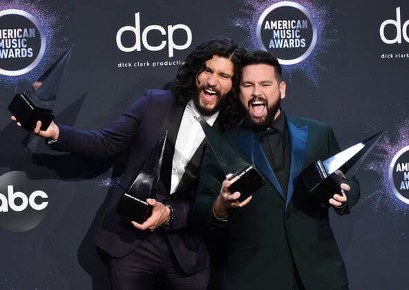 (L-R) Dan Smyers and Shay Mooney of Dan + Shay appear backstage with their awards for Favorite Song - Country for Speechless and Favorite Duo or Group ? Country, during the 47th annual American Music Awards at the Microsoft Theater in Los Angeles on Sunday, November 24, 2019.  LAP20191124442 JIMxRUYMEN