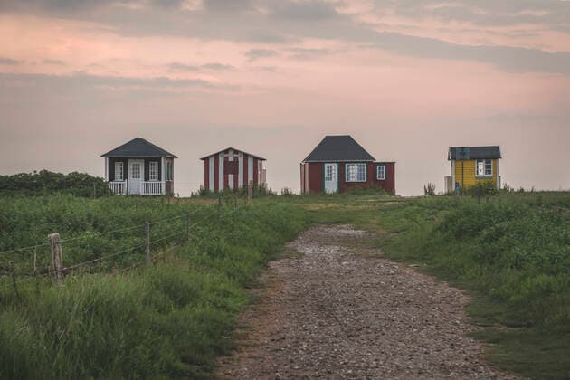 Denmark, Aeroe, Aeroskobing, Traditional baths seen at dawn from road  KEBF01365