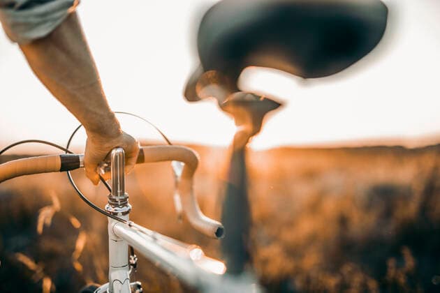 Man holding his racing bicycle outdoors model released Symbolfoto  MKF00007