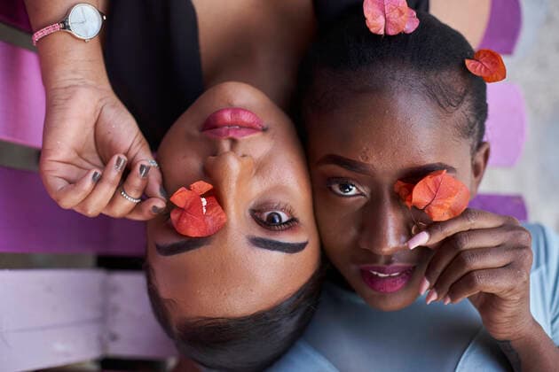 Creative Highlights Symbolfotos Portrait of two young women covering eyes with flowers model released Symbolfoto  VEGF00785