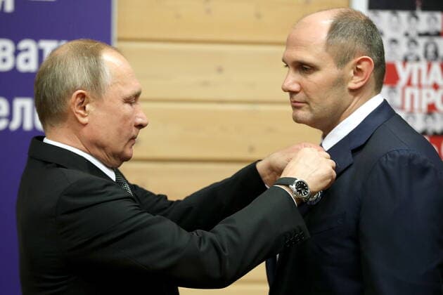 ST PETERSBURG, RUSSIA - NOVEMBER 27, 2019: Russia s President Vladimir Putin (L) and Mikhail Rakhlin, president of the Turbostroitel judo club, awarded the Order of Honor, during a ceremony to present state awards at the Turbostroitel judo club. Mikhail Tereshchenko TASS  TS0C503B