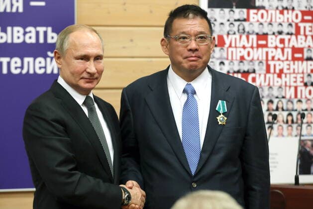 ST PETERSBURG, RUSSIA - NOVEMBER 27, 2019: Russia s President Vladimir Putin (L) and Nobuyuki Asai, president of Kanda Seisakusho company, awarded the Order of Friendship, during a ceremony to present state awards at the Turbostroitel judo club. Mikhail Tereshchenko TASS  TS0C503E