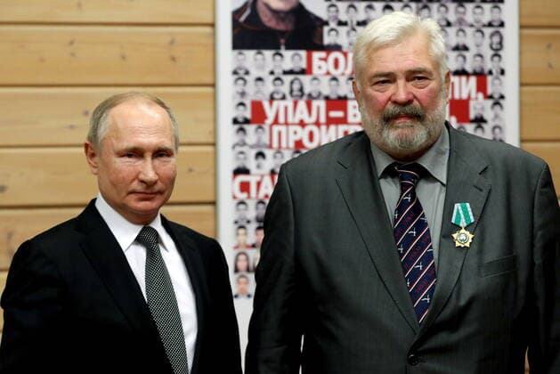 ST PETERSBURG, RUSSIA - NOVEMBER 27, 2019: Russia s President Vladimir Putin (L) and Yevgeny Yefremov, director of the judo veterans support department at the Anatoly Rakhlin Support Fund for Support and Development, awarded the Order of Friendship, during a ceremony to present state awards at the Turbostroitel judo club. Mikhail Tereshchenko TASS  TS0C5040