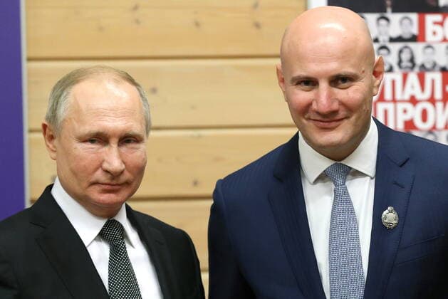 ST PETERSBURG, RUSSIA - NOVEMBER 27, 2019: Russia s President Vladimir Putin (L) and Yevgeny Rakhlin, head of the referees association of the high performance sport department at the Regional Sports Judo Federation of St Petersburg, awarded the Merited Physical Culture Worker title, during a ceremony to present state awards at the Turbostroitel judo club. Mikhail Tereshchenko TASS  TS0C5067