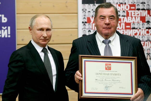 ST PETERSBURG, RUSSIA - NOVEMBER 27, 2019: Russia s President Vladimir Putin (L) and Vasily Shestakov, president of the International Sambo Federation, who has received a certificate of merit, during a ceremony to present state awards at the Turbostroitel judo club. Mikhail Tereshchenko TASS  TS0C506C