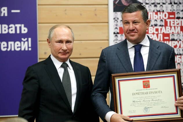 ST PETERSBURG, RUSSIA - NOVEMBER 27, 2019: Russia s President Vladimir Putin (L) and Maxim Shubarev, a member of the Board of Trustees of the Turbostroitel judo club, who has received a certificate of merit, during a ceremony to present state awards at the Turbostroitel judo club. Mikhail Tereshchenko TASS  TS0C506D