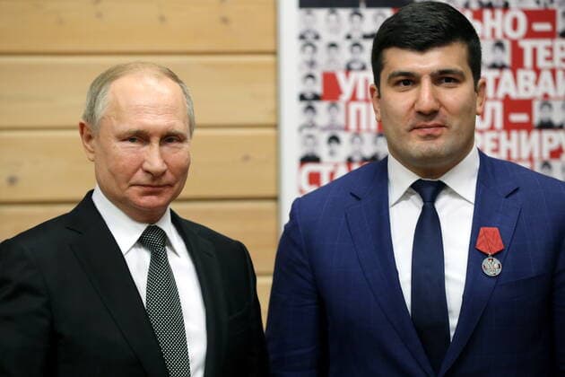 ST PETERSBURG, RUSSIA - NOVEMBER 27, 2019: Russia s President Vladimir Putin (L) and instructor Tagir Khaibulayev, awarded the Order For Merit to the Fatherland (2nd class), during a ceremony to present state awards at the Turbostroitel judo club. Mikhail Tereshchenko TASS  TS0C5050