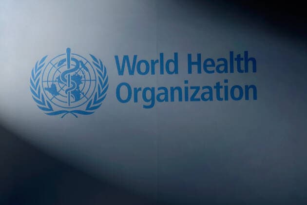 WHO flag in Geneva WHO logo in Geneva, 03 08 2019, Geneva, Switzerland The WHO logo is on an illuminated flag.
